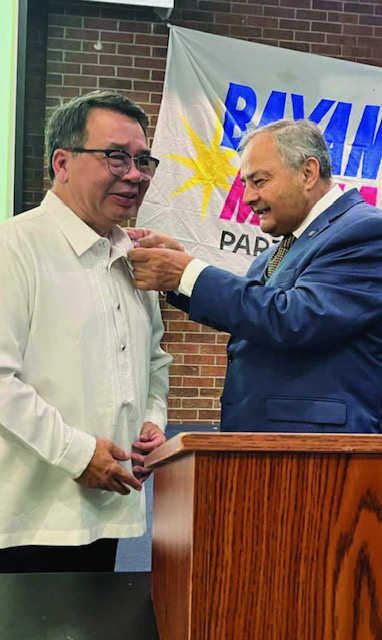 During Neri Colmenares' visit to Toronto as part of his Human Rights Tour in Canada, Thomas S. Saras, President and CEO of the National Ethnic Press and Media Council of Canada, bestowed the organization's official medal upon him in honor of his contributions to social justice and human rights. (Photo credit: Mila Garcia)